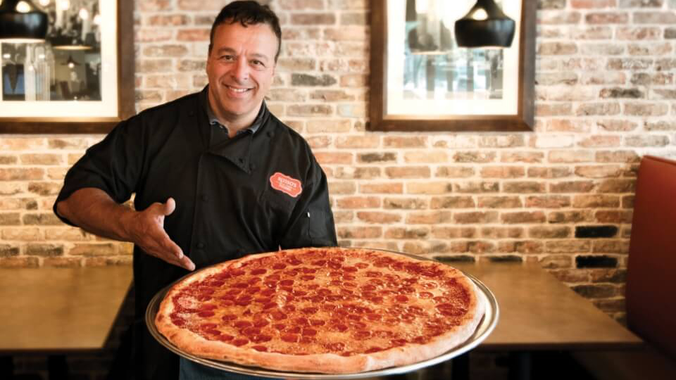 Anthony with giant pizza