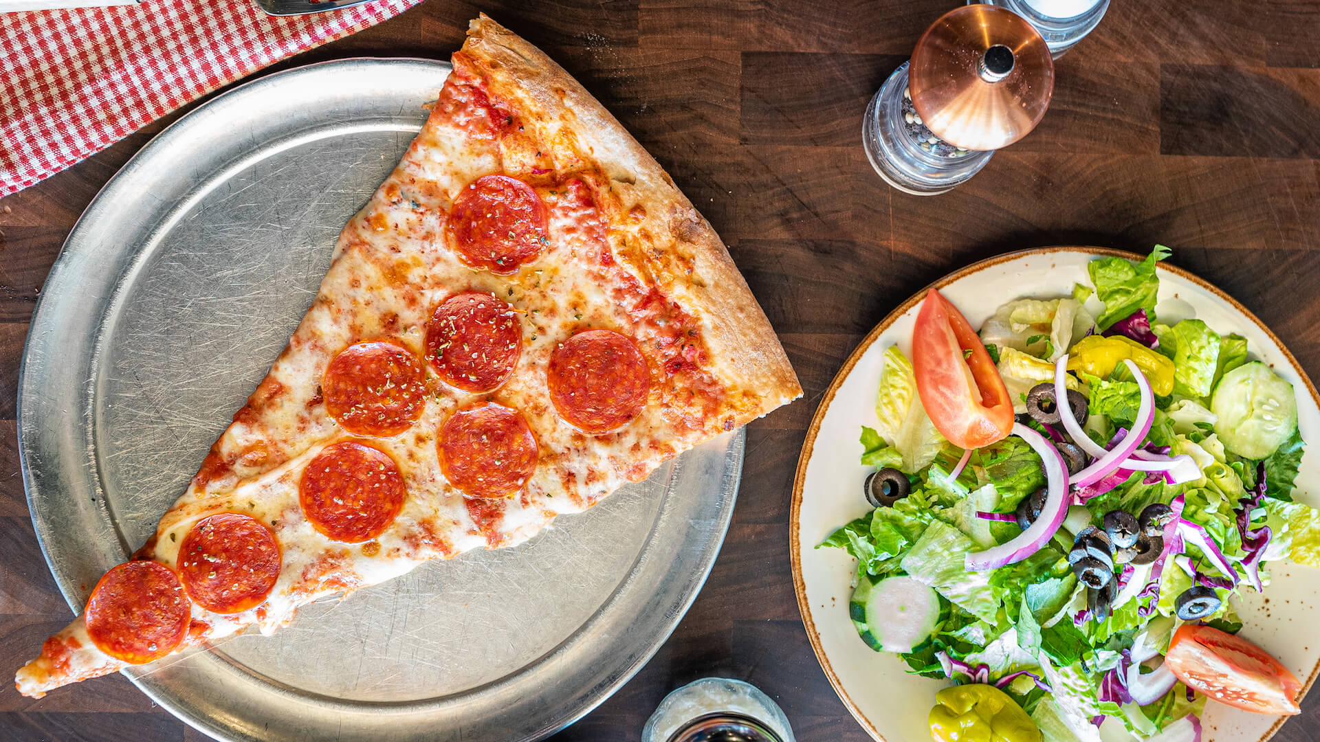 Pepperoni Giant pizza slice and side salad