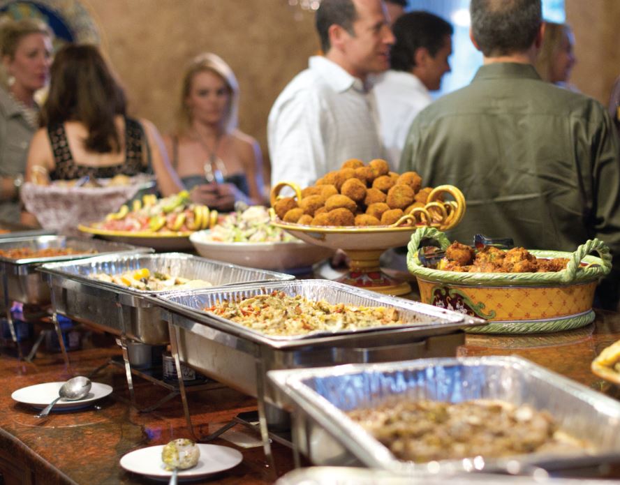 family and friends gathered around russo's catering italian cuisine